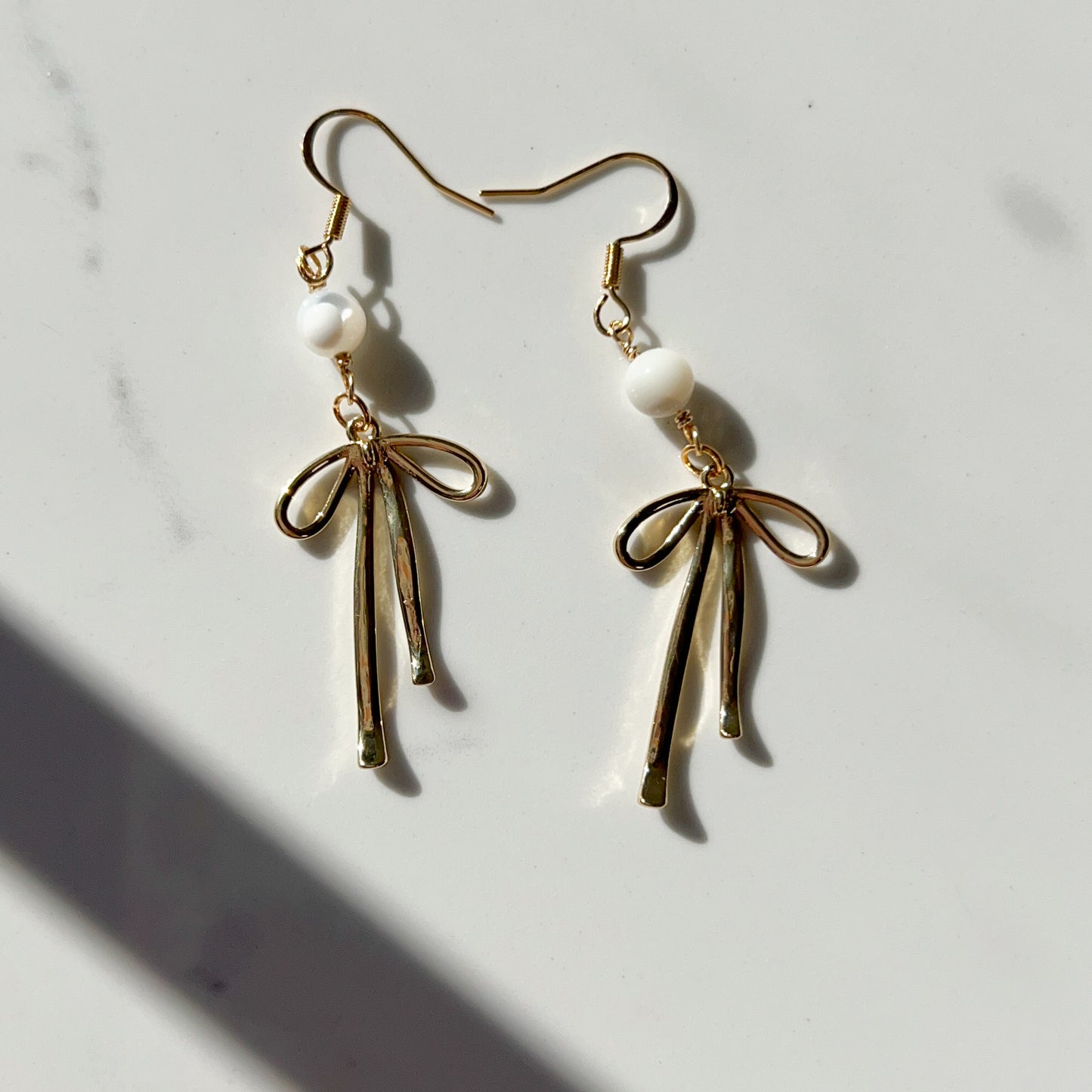 DAINTY GOLD FILLED BOW + MOTHER OF PEARL DANGLES